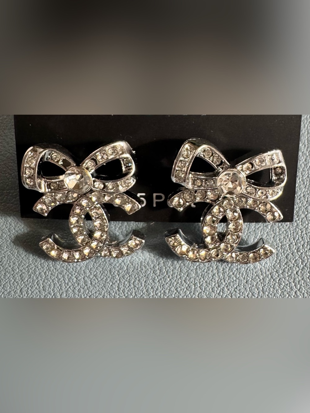Crystal Bow Logo Stud Earrings - Silver Tone